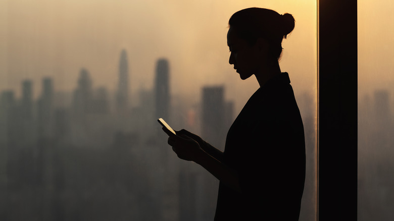 silhouette of person on smartphone