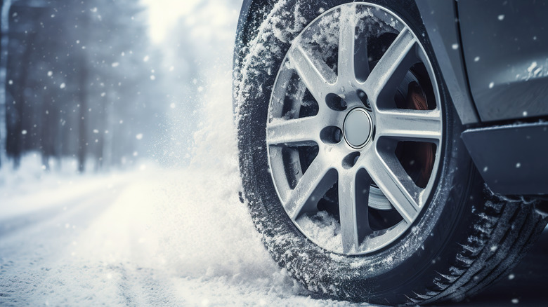Car tire on snowy road
