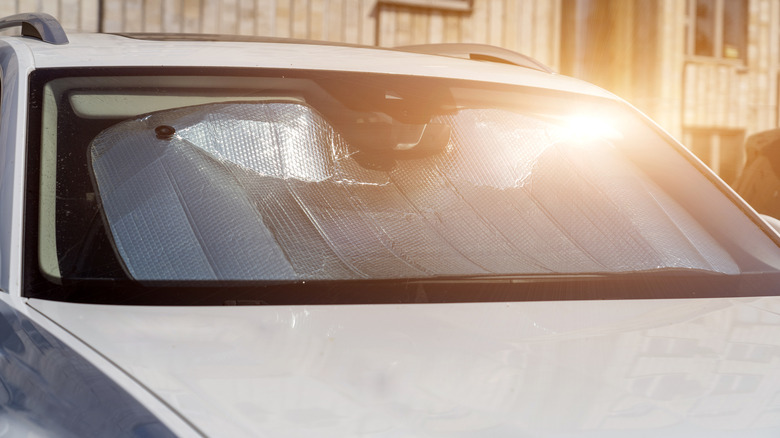 Car with shade in windshield