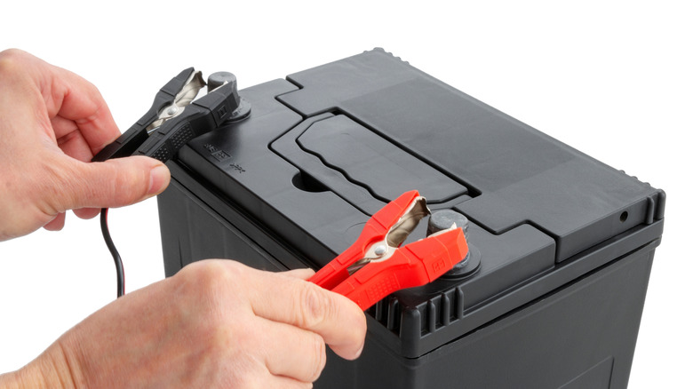 Charger clamps being connected to an AGM car battery