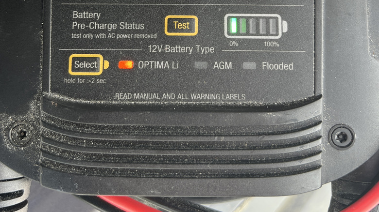 A close-up of a lead acid battery charger with an AGM mode