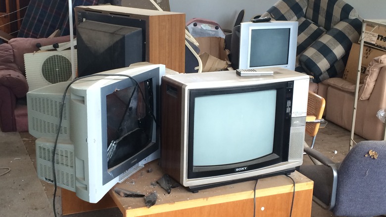 old TVs on shelf