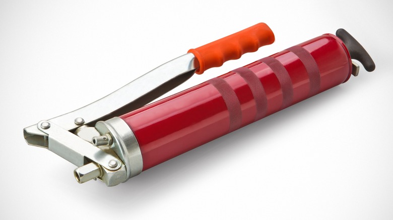 A red grease gun