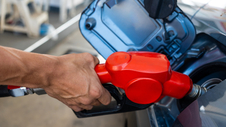 Pumping fuel into a car's fuel tank