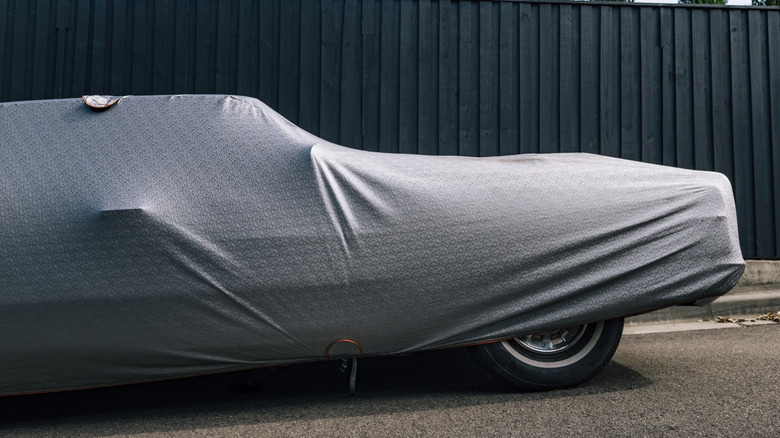 Parked car with a protective cover