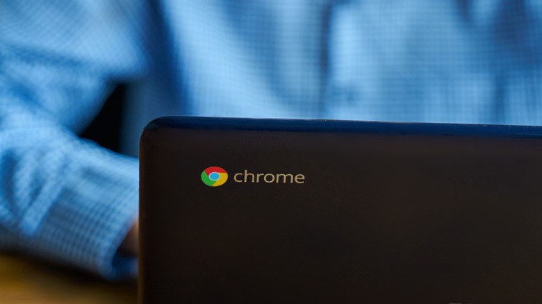 man using Chromebook laptop