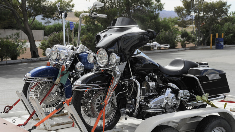 Motorcycles tied on trailer