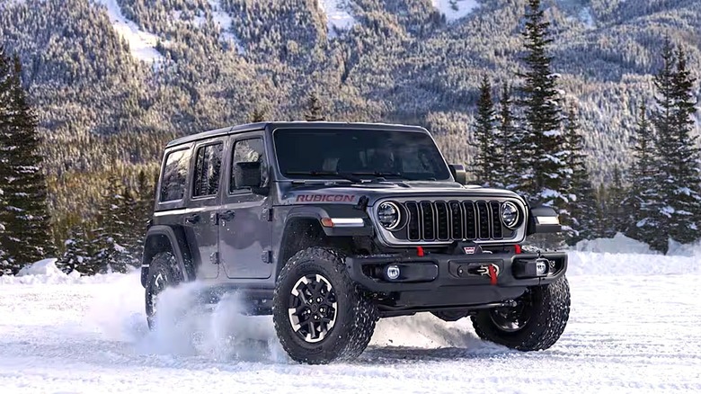Jeep Wrangler riding through a snowy field