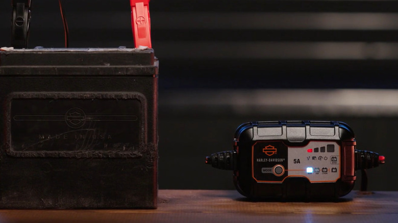 Harley-Davidson 5A charger connected to battery and showing red charge LED
