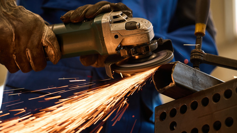Sparks flying off of a cutting angle grinder.