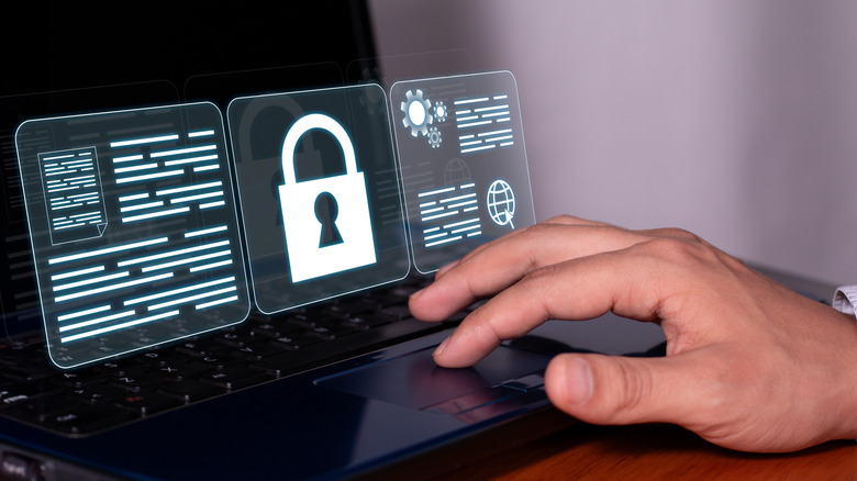 A lock icon in front of a laptop