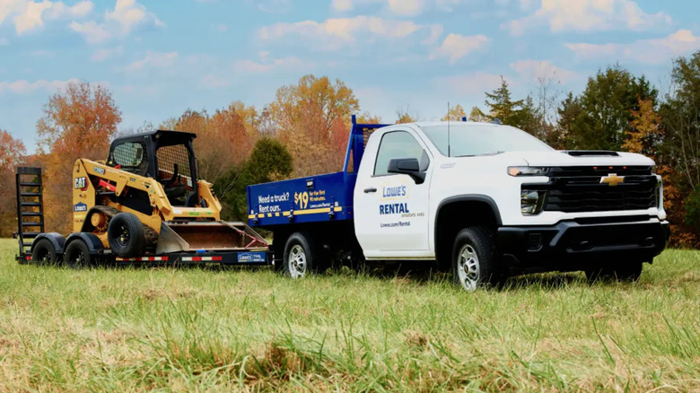 Lowe's pick up truck in a field