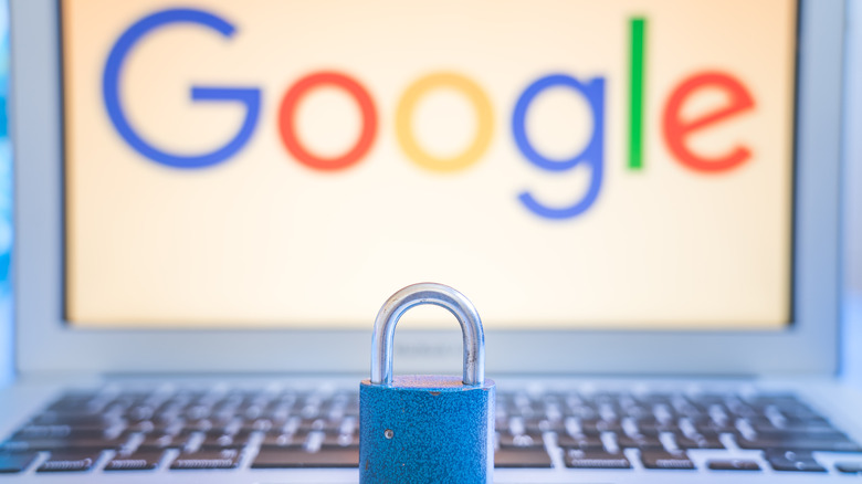 Laptop with Google logo on screen and small lock on keyboard