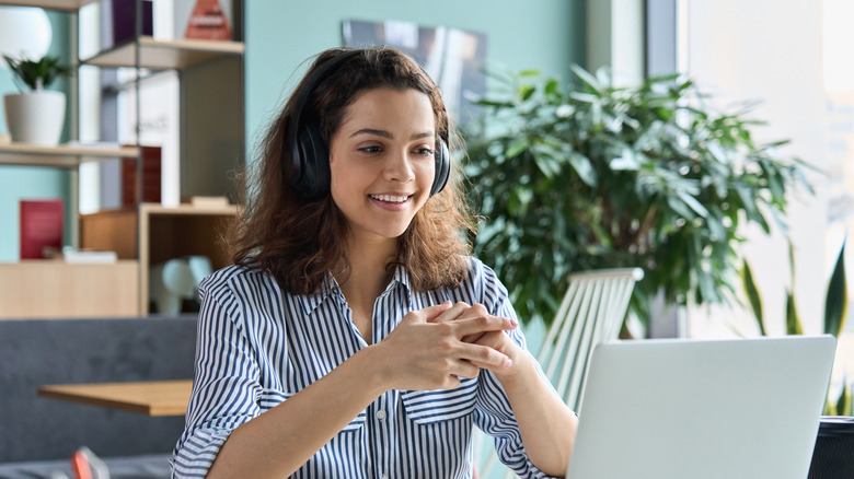 Woman using laptop for web meeting