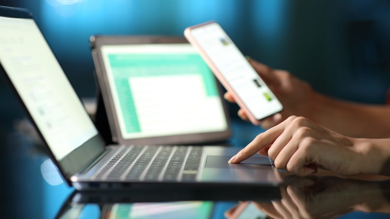 person using multiple devices at once