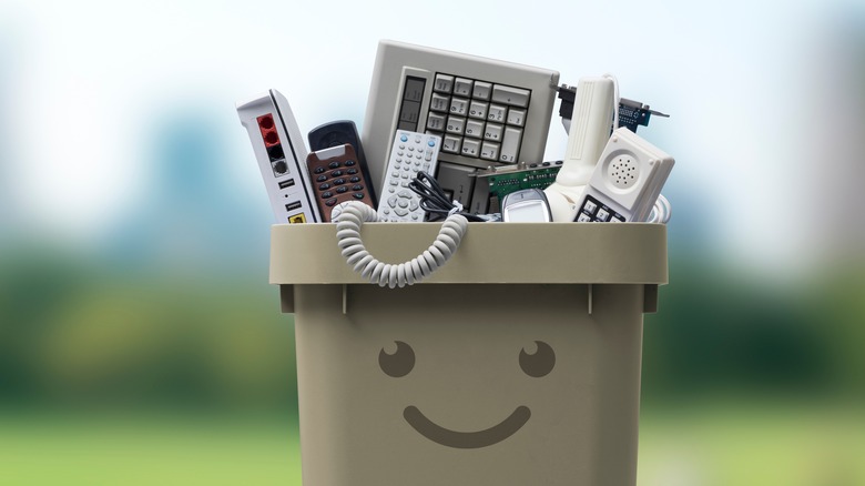 Smiling electronics recycling bin