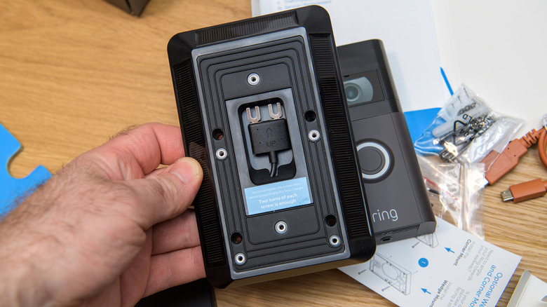 Man workig on Ring doorbell