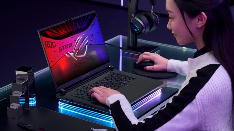 Woman using an Asus ROG Strix laptop