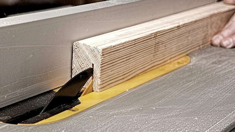 DeWalt table saw slicing into wood