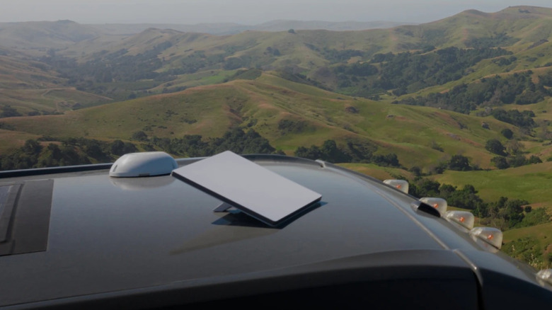 Starlink dish on a vehicle showing landscape in the background