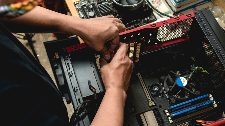 Person disassembling computer