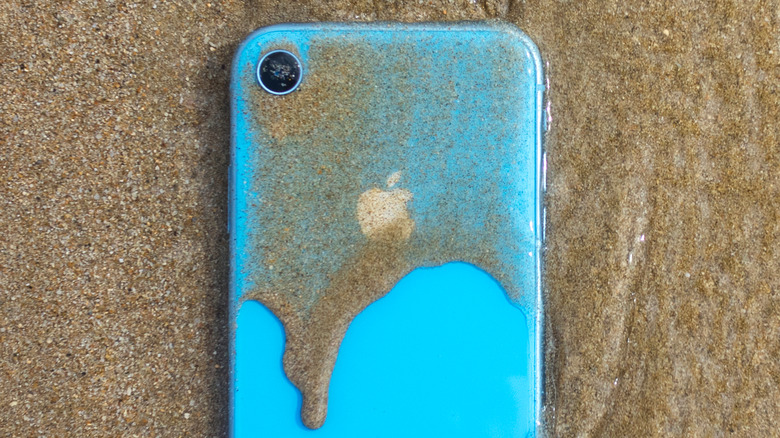 iPhone in wet sand