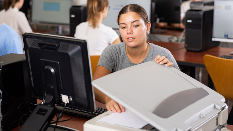 Woman in computer class scanning a document