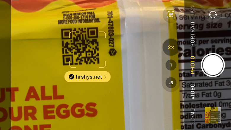 Scanning a QR code on the back of candy packaging