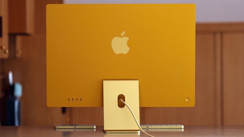 Yellow iMac computer desk