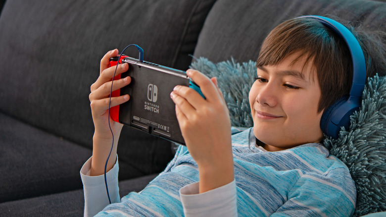 Child playing Nintendo Switch