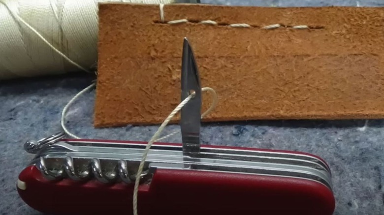 SAK Awl being used to sew