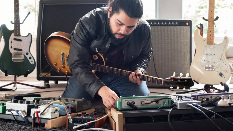 guitar player preparing for practice