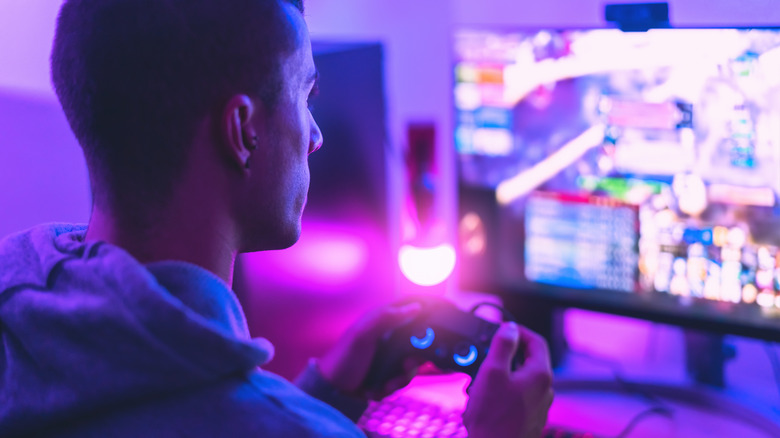 Man playing game controller