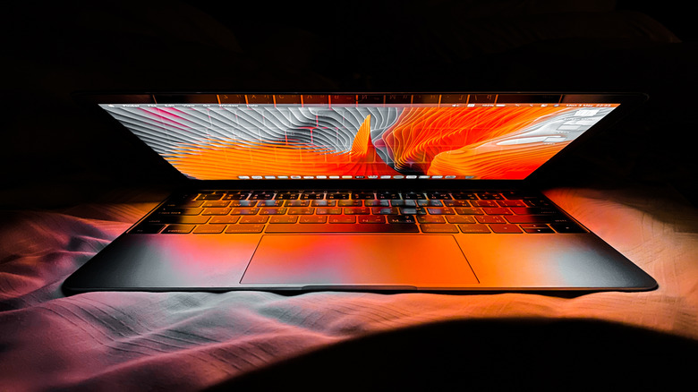 MacBook with lid open and screen awake