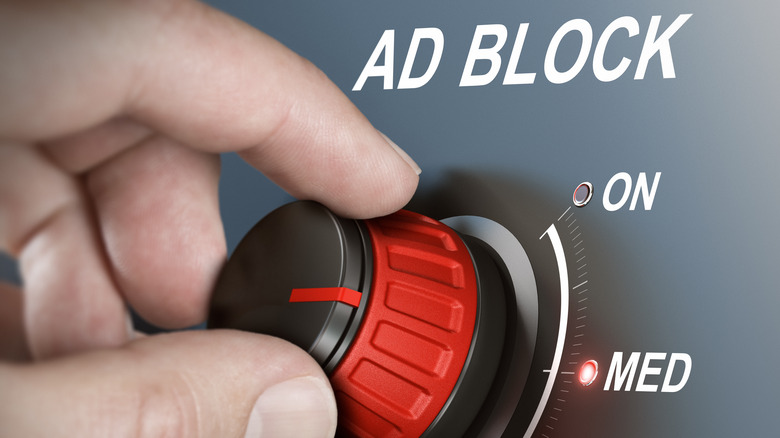 Hand adjusting Ad Block dial between "On" and "Medium"