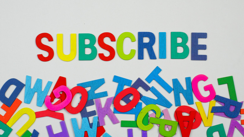 Multicolored letters arranged to spell "Subscribe"