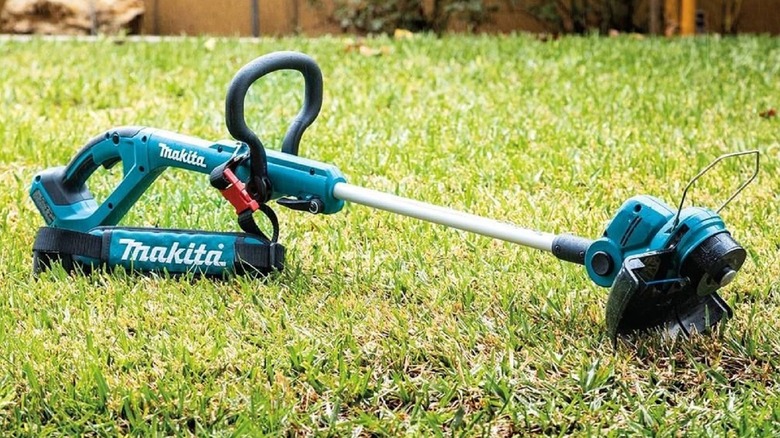 A Makita string trimmer shown in the grass
