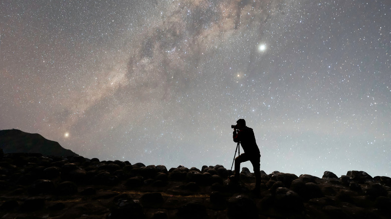 man capturing the night sky
