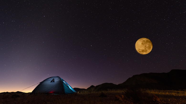 tent with moon in the background