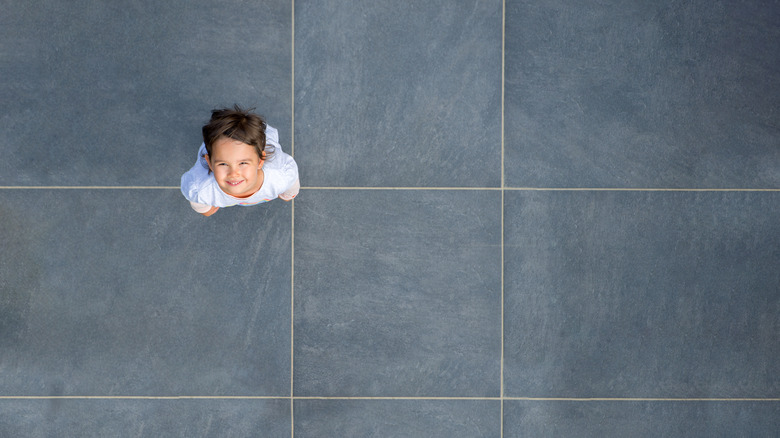 girl looking up with grid in background