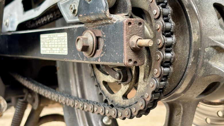 Motorcycle chain and sprocket exposed