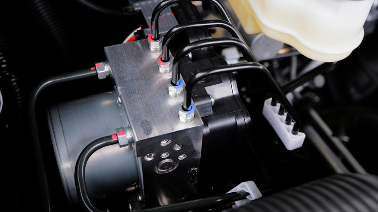 Anti-lock braking module located in an engine bay