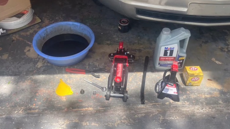 A collection of tools necessary for an oil change