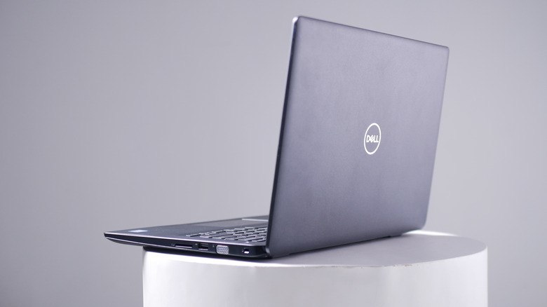 Dell laptop sitting on a round table