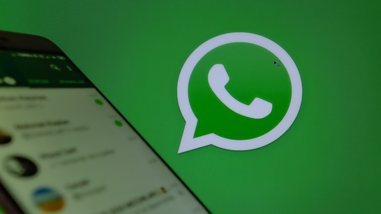 WhatsApp on phone with logo