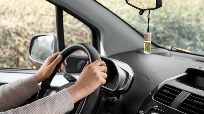 Car deodorizer hanging on rearview mirror