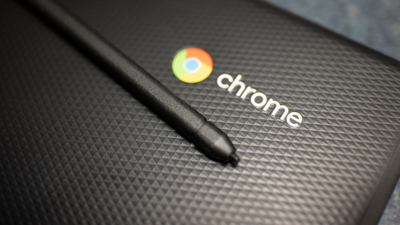 Chromebook lid with logo and stylus