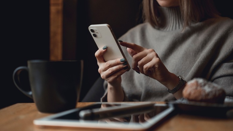 Woman using an iPhone