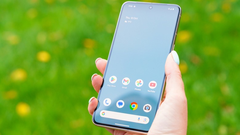 person holding Google Pixel 8