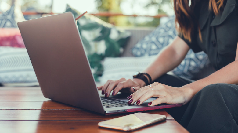 Woman Using Laptop in cafe